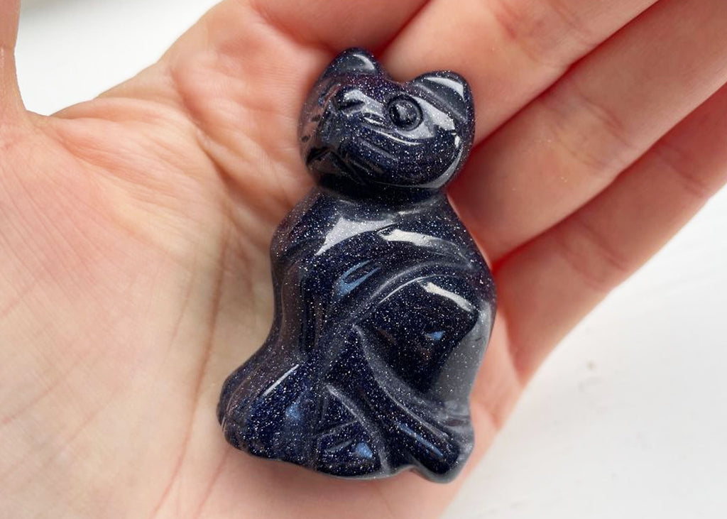 Carved And Polished Blue Goldstone Cat